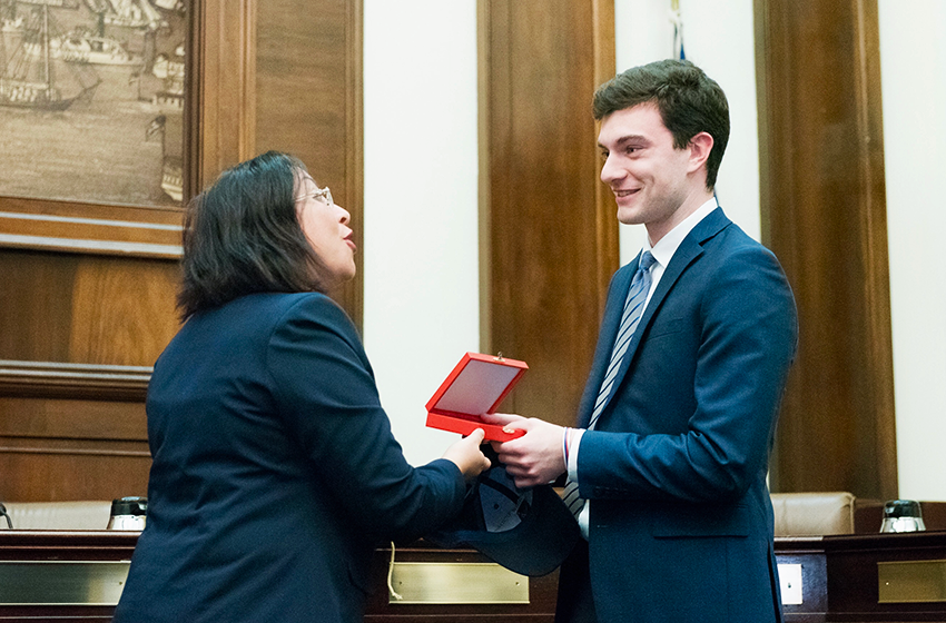 Matthew receiving a gift from his internship