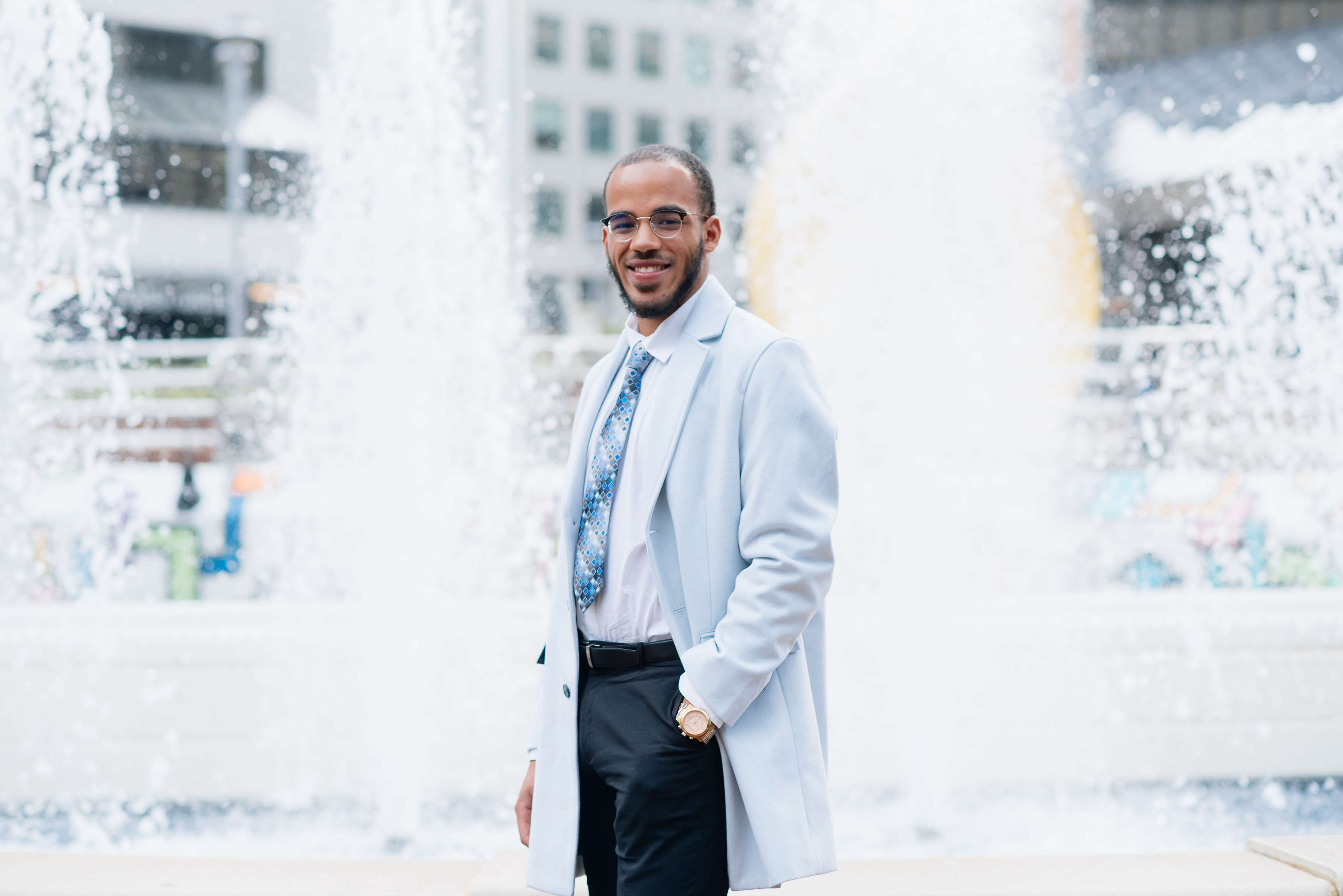 Health professional in front of decorative water fountain