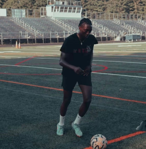 Yves Agbodoh playing soccer (football) within the DMV community