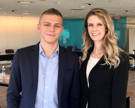 Gina DeMatteo, a senior at Suffolk University, and a fall semester intern for Grant Thornton, pauses for a picture with one of her colleagues. Gina DeMatteo with a colleague