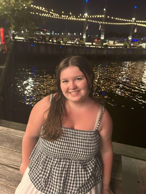 Abigail Hamill on the water's edge in Washington, D.C. during the Academic Internship Program