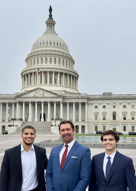 Jack Hartung standing with another intern from The Washington Center and Mike Leventhal, Executive Director at Men's Health Network