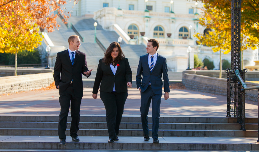 Interns strolling in front of the Capitol building