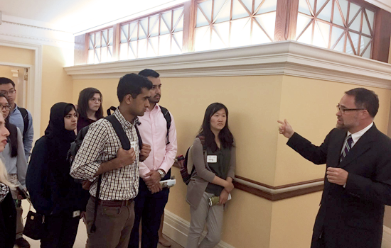 Civic Digital Fellows listen in on a guided tour through the halls of the Library of Congress