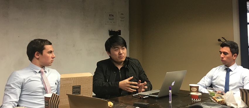 Nick Fu (center), the founder of one of 1776’s numerous start-ups, HousePouch, makes a point during lunch with TWC interns. Nick Fu